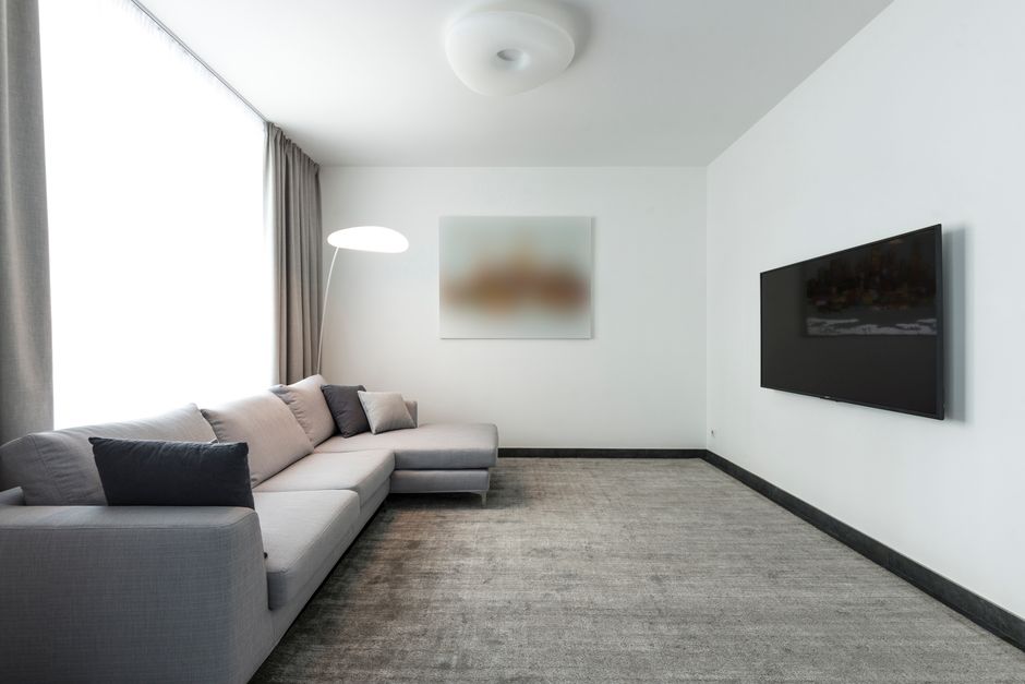 A beautifully clean living room carpet showcasing our premium cleaning services